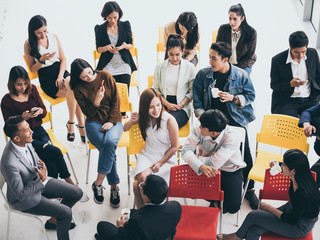 Group of people are talking together while taking a coffee break from seminar