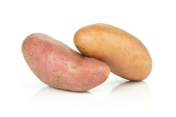 Group of two whole fresh red potato francelina variety isolated on white background