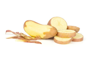 Group of one whole one half four slices of fresh red potato francelina variety one is peeled isolated on white background