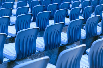 Rows of seats in an open air theater, close up