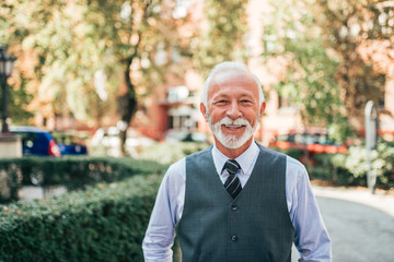 Portrait of a handsome senior man outdoors.