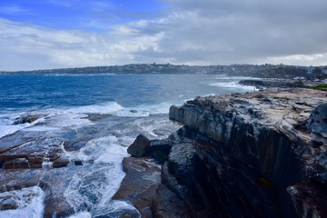 waves crashing on rocks