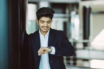 business, technology, communication and punctuality concept - close up of businessman calling on...