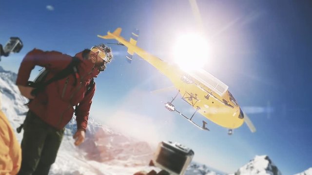 Helicopter / Heliboarding snowboarding Winter sport in Europe Alpes, action cam concept