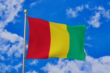 Guinea national flag waving isolated in the blue cloudy sky realistic 3d illustration
