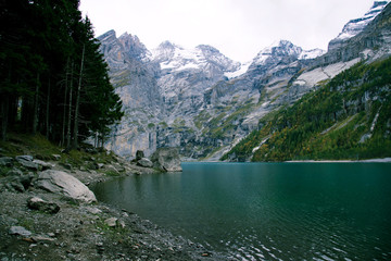 View of Oeschinen Lake in the Swiss alps with beautiful turquoise water.