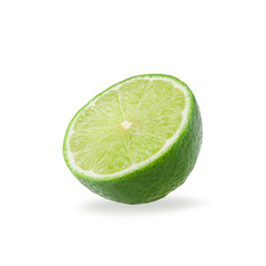 Half with slice of fresh green lime isolated on white background