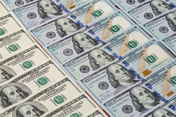 a pile of American paper hundred-dollar bills as an element of the world financial system