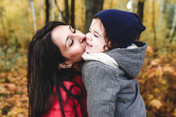 Fototapeta premium happy mather and child in autumn park