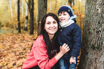 mather and child in autumn park