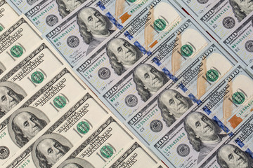 a pile of American paper hundred-dollar bills as an element of the world financial system