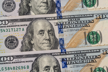 a pile of American paper hundred-dollar bills as an element of the world financial system