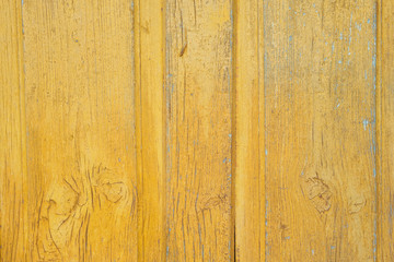 Obraz premium Wooden surface with old yellow paint. Close-up. Background. Texture