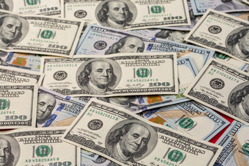 a pile of American paper hundred-dollar bills as an element of the world financial system