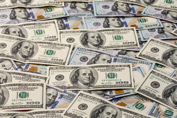 a pile of American paper hundred-dollar bills as an element of the world financial system