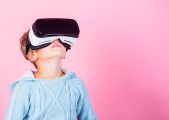 Explore alternative reality. Cyber space and virtual gaming. Virtual reality future technology. Discover virtual reality. Kid boy wear vr glasses pink background. Child boy play virtual reality game