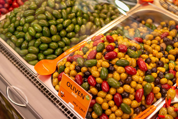 Different kinds and colors of olives at city market of Vienna - Austria