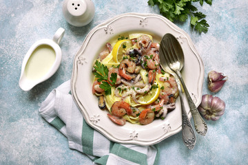 Tagliatelle pasta with seafood in a cream sauce.Top view.
