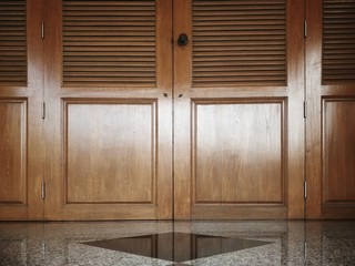 Reflect light on surface of the old vintage wooden door with marble floor in home exterior decoration design concept