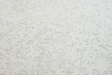 Texture of decorative plaster with a relief. White plaster Close-up.