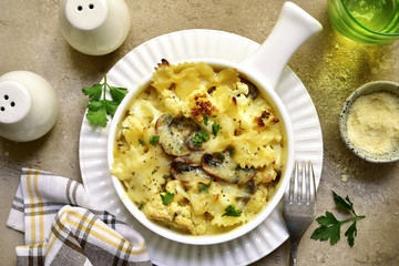 Pasta casserole with mushrooms and cauliflower in a cream sauce.Top view.