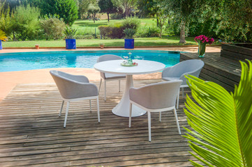 Dining table with chairs and table appointments for 4 persons.
