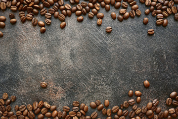Food background with roasted black coffee beans.Top view with copy space.