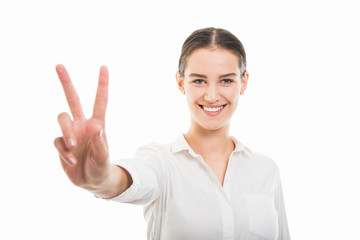 Young pretty bussines woman showing victory gesture