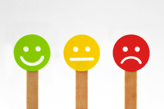 Green, yellow and red smiley faces with positive, neutral and negative expression