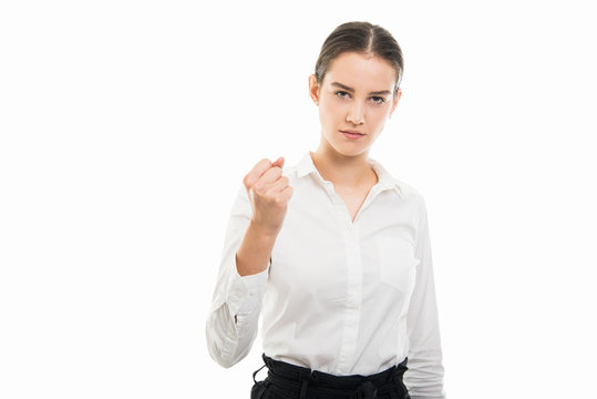 Young pretty bussines woman showing angry fist gesture