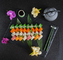 tasty sushi on black background