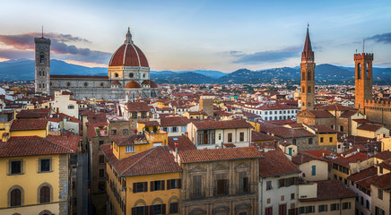 Fototapeta na wymiar Panoramic view of Florence sunset city skyline with Cathedral and bell tower Duomo and Palazzo del Bargello. Florence, Italy.