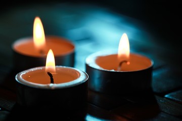 Lit Candles on a Wooden Table