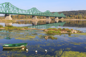 Fototapeta na wymiar Edward Smigly-Rydz Road - Bridge over Vistula River in Wloclawek, Poland. A steel truss bridge connecting City Center with Zawisle district.