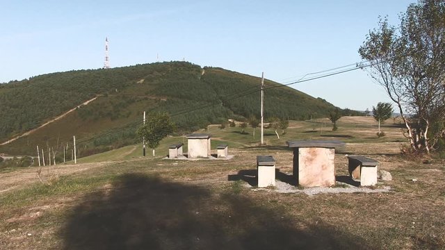 STONE BANKS AND MOUNTAIN WITH COMMUNICATION ANTENNA