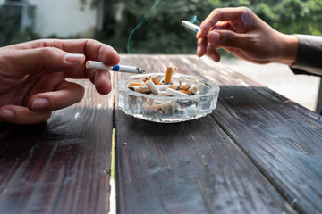 Man keep cigarette in hand