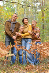 Fototapeta premium Portrait of family of four in park