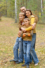 Fototapeta premium Portrait of family of four in park