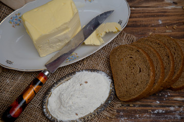 White wheat rye sliced tasty and delicious bread on wooden background