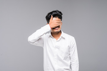 Closeup portrait of young man, closing, covering blind eyes with hands can't see, hiding, avoiding...