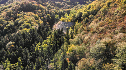 Aerial view of mountains in national park Cheile Nerei Beusnita in Romania. Part of Carpathian mountains with beautiful autumn colors.