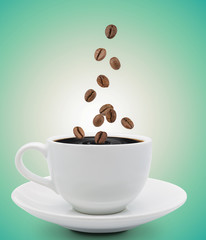 coffee beans falling into cup
