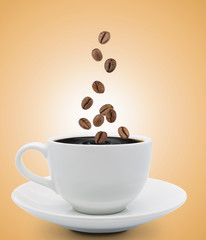 coffee beans falling into cup