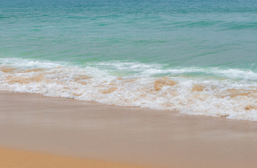Fototapeta na wymiar soft wave on a sandy beach
