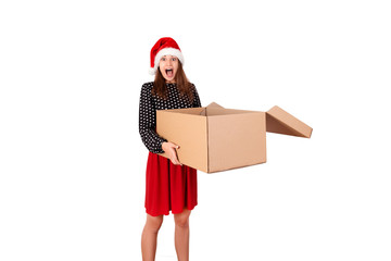 Shocked and surprised pretty young woman holding open big carton gift box. isolated on white background. holidays concept