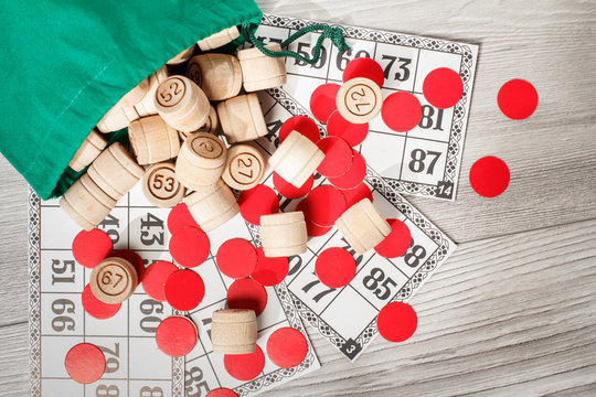 Wooden lotto barrels with bag, game cards and red chips