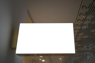 Horizontal rectangular white empty signage mock up of store, shop in shopping mall