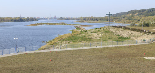 Vistula River near dam in Wloclawek. View towards the city of Wloclawek. It is the place of martyrdom of  priest Jerzy Popiełuszko - obrazy, fototapety, plakaty