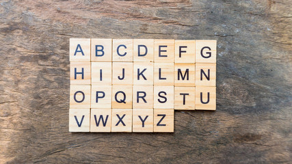 English language text print on square wood block A to Z