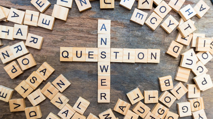 Question answer text on wood squaer block